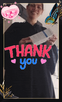 a woman is holding a box and says thank you