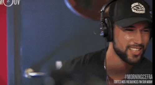 a man wearing headphones and a hat that says ' gentlemen 's recovery ' on it