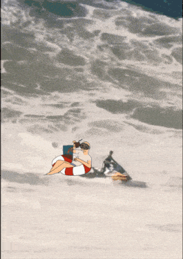 a man is riding a jet ski on the beach