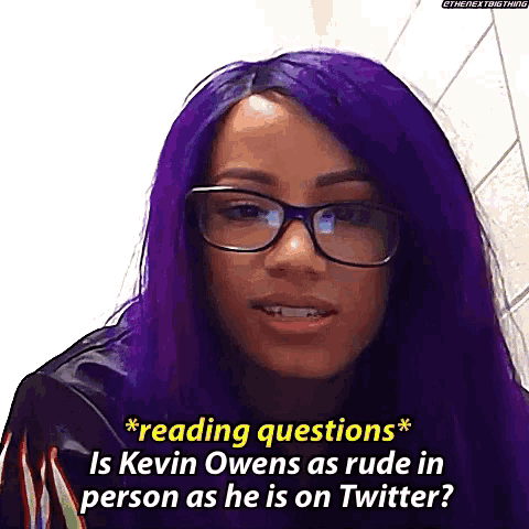 a woman with purple hair and glasses is reading questions about kevin owens as he is on twitter