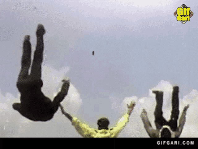 a man is falling through the air with a gifgari.com logo in the background