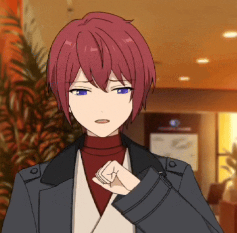 a man with red hair and blue eyes is wearing a jacket and a turtleneck