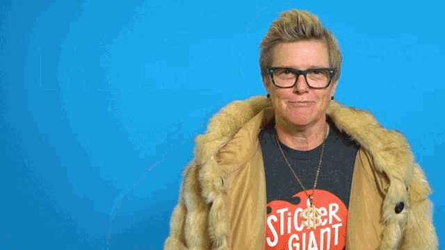 a woman wearing glasses and a fur coat has the word baller written above her head
