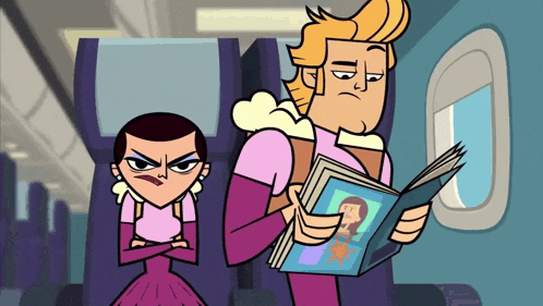 a man is reading a book while a woman sits next to him