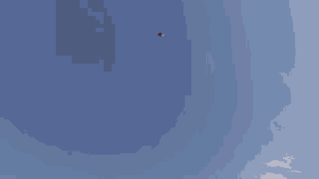 a person is hanging upside down in the air with a blue sky behind them