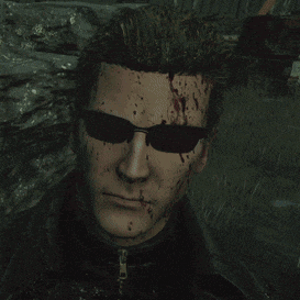 a man with blood on his face wearing sunglasses and a leather jacket