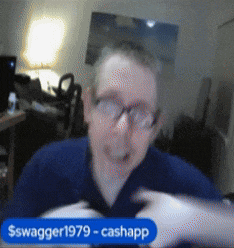 a man wearing glasses and a blue shirt is sitting in front of a sign that says $ swagger1979-cashapp