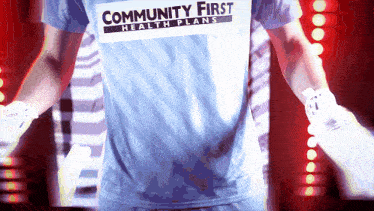 a man wearing a blue shirt that says community first health plans