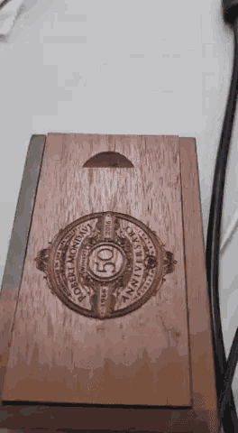 a wooden box with a robert mondito logo on it