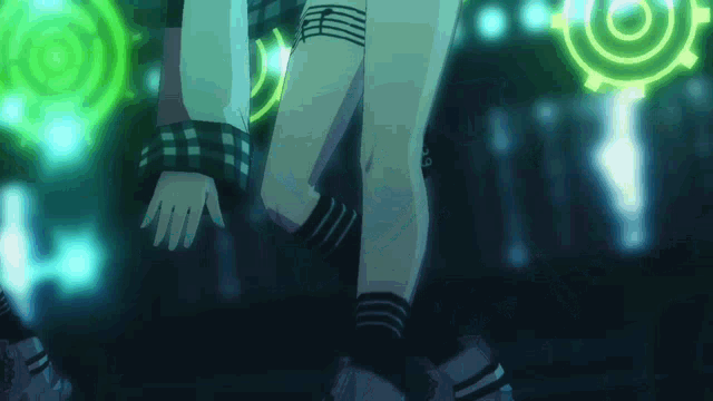a person 's legs are shown in a dark room with a green circle in the background
