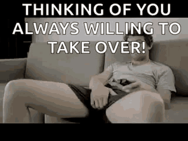 a man is sitting on a couch with his legs crossed and his pants down .