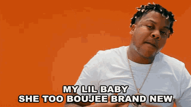 a man in a white shirt is saying my lil baby she too boujee brand new