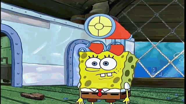 a cartoon of spongebob wearing a red bow
