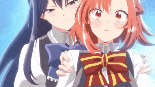 a girl with red hair is hugging another girl with long black hair
