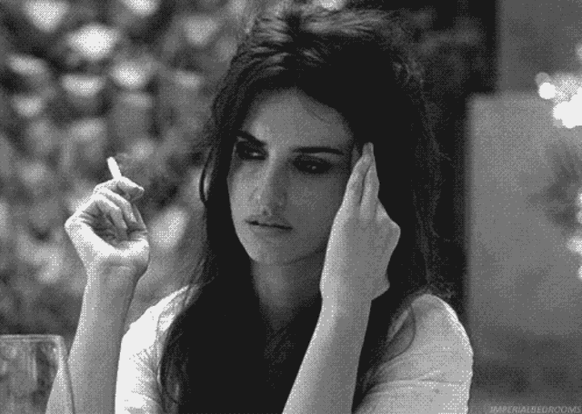 a woman is smoking a cigarette in a black and white photo with the caption imperial bedrooms