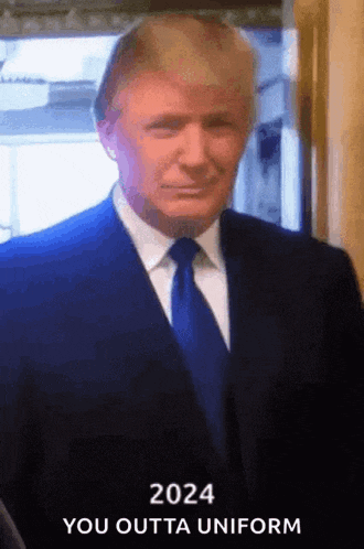 a man in a suit and tie with the words " 2024 you outta uniform " below him