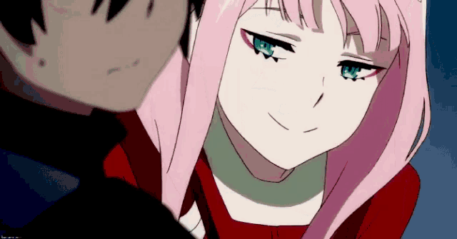 a girl with pink hair and blue eyes is looking at a man