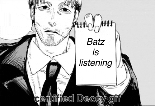 a man in a suit and tie is holding a notepad with batz is listening written on it