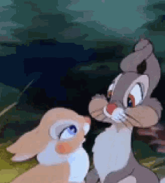 two cartoon rabbits are standing next to each other in the grass