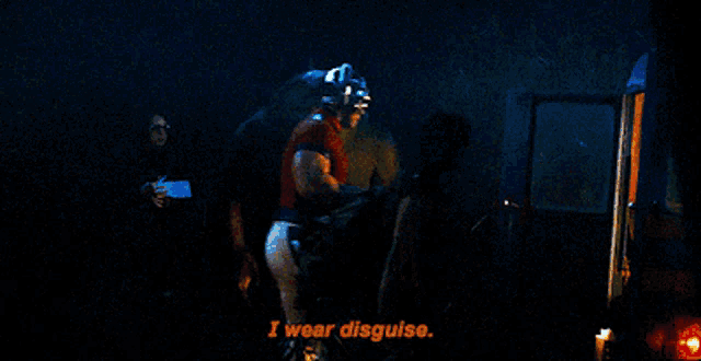 a shark says i wear disguise while standing next to a man
