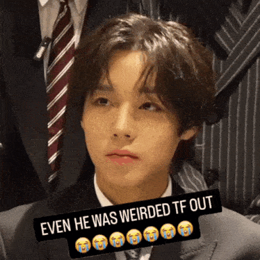 a man in a suit and tie with the words even he was weirded tf out above him