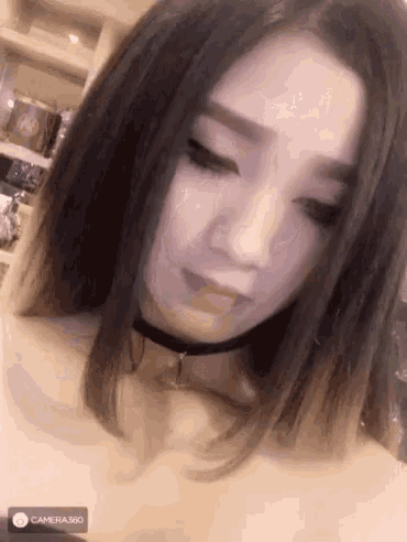 a close up of a woman 's face with a camera 360 logo in the corner
