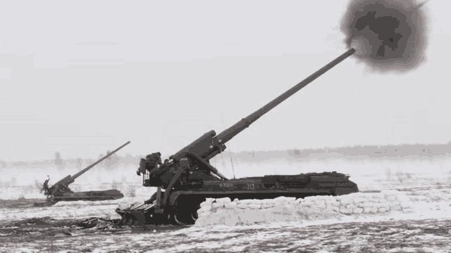 a black and white photo of a military vehicle with the number 103 on the side