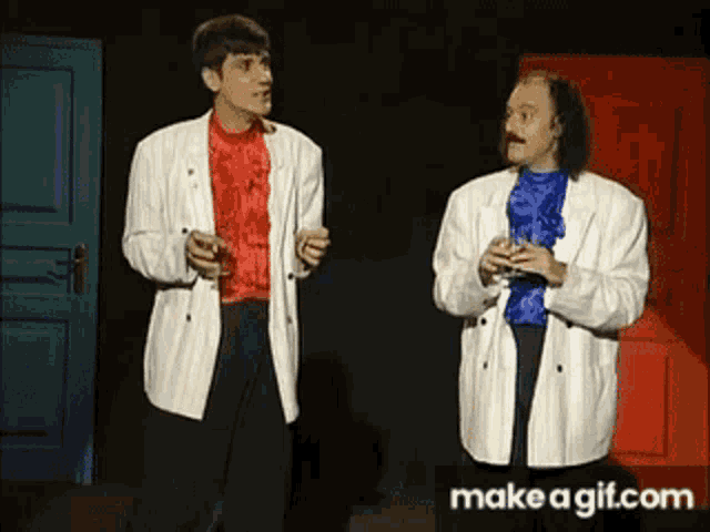 two men standing next to each other in front of a red door with make a gif.com written on the bottom