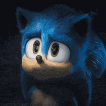 a close up of sonic the hedgehog 's face in a dark room