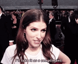 a woman is saying i 'll take it as a compliment .
