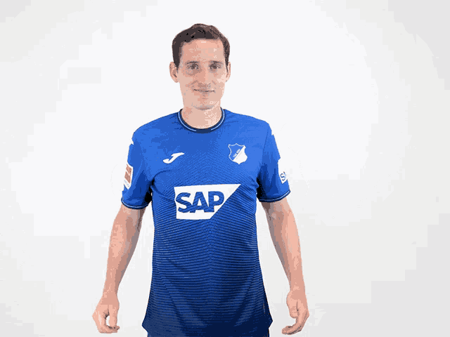 a man wearing a blue shirt that says sap