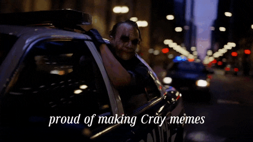 a joker in a police car with the words proud of making cray memes
