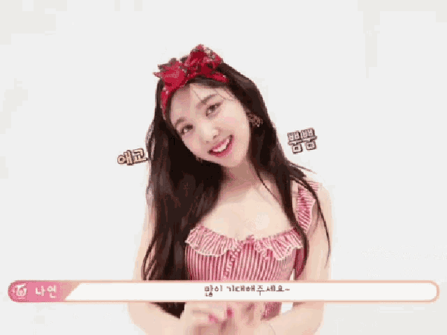 a woman in a striped top with hearts on her earrings