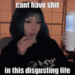 a girl with blue hair is eating a piece of food with a caption that says cant have shit in this disgusting life .