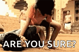 a man is laying on top of another man with the words `` are you sure '' written on it .
