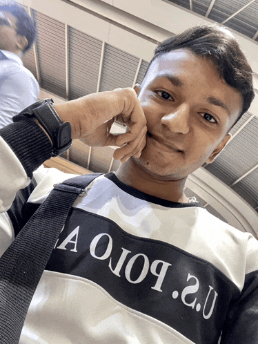 a man wearing a black and white shirt that says aoio9 2.0