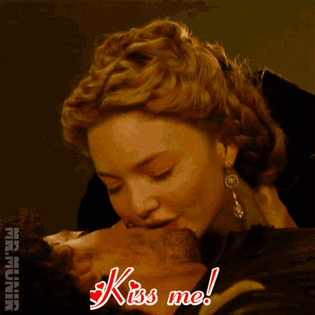 a picture of a woman kissing a man with the words kiss me on it