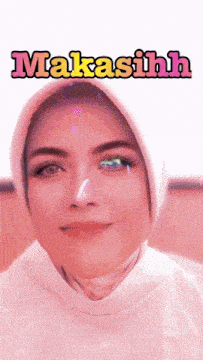 a woman wearing a hijab and a pink background with the word makasiihh