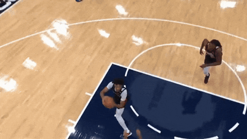 a basketball game is being played on a court with a washington logo on it