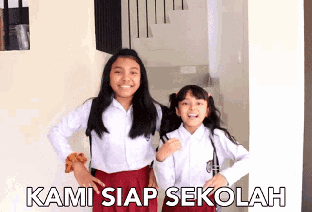 two girls are standing next to each other with the words kami siap sekolah written on the bottom