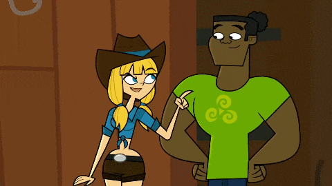 a man in a green shirt is standing next to a woman in a cowboy hat .