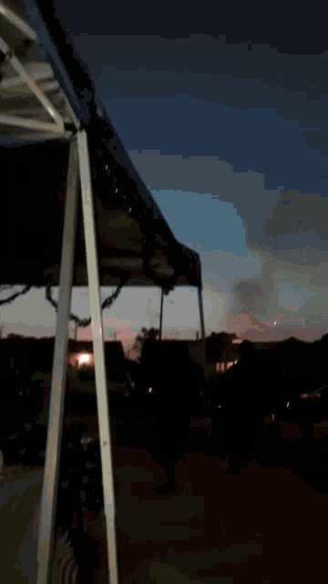 a group of people are standing in front of a fire