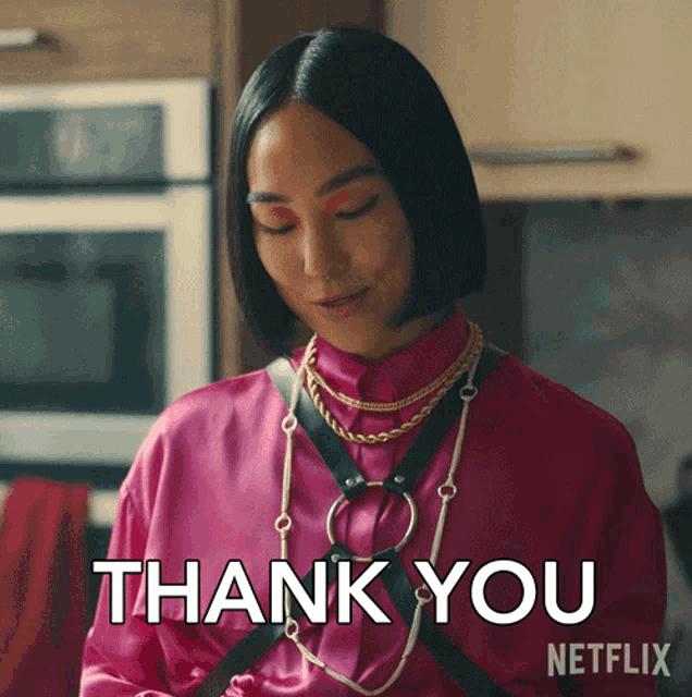 a woman in a pink shirt says " thank you " in a netflix ad