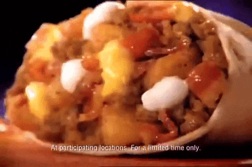 a close up of a burrito with the words " at participating locations for a limited time only "