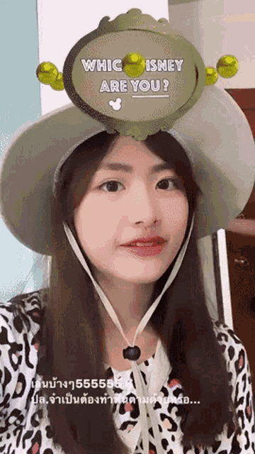 a woman wearing a hat that says " whic isney are you " on it