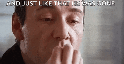 a close up of a man covering his mouth with his hand and a caption that says `` and just like that he was gone '' .