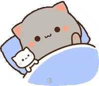 a cartoon cat is laying in a bed with a pillow .