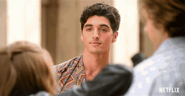 a netflix ad shows a young man talking to a woman