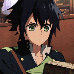 a boy with green eyes is holding a book