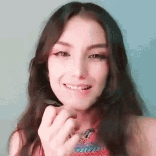 a close up of a woman 's face with a tooth missing and smiling .